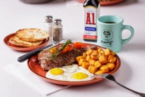 A plate of steak and eggs with coffe at Saginaw's Deli. 