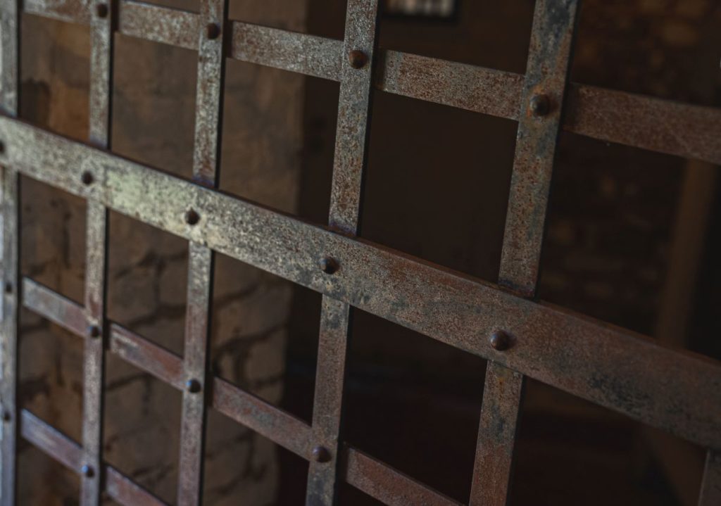 Iron bars of a prison cell.