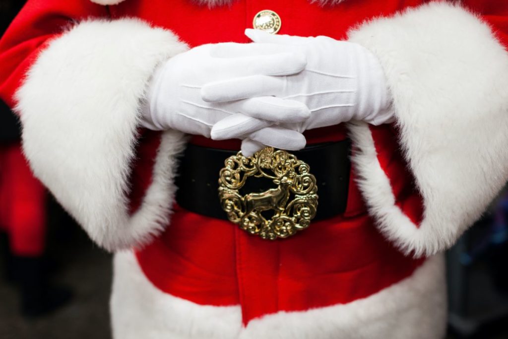 Santa Claus' red coat and black belt.